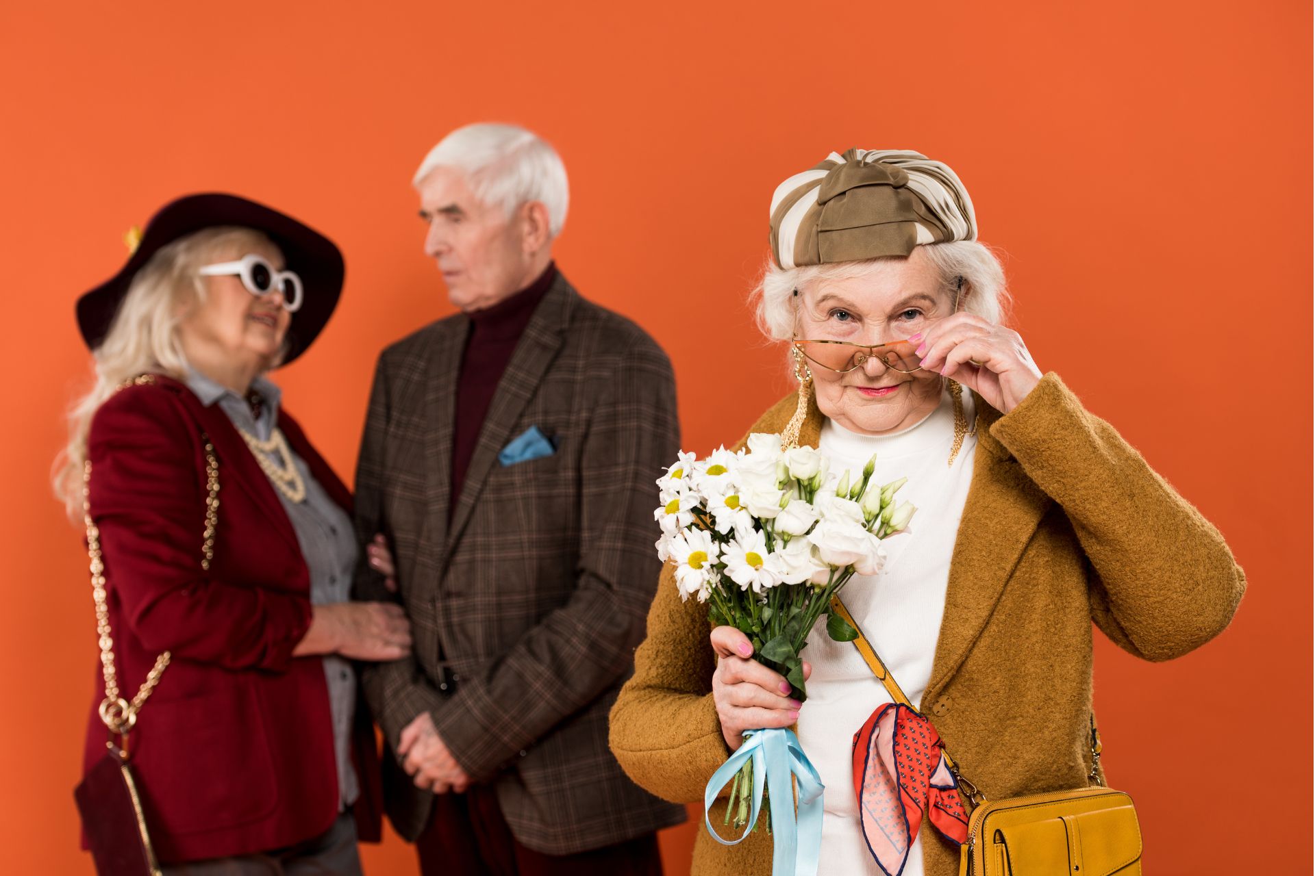 Three senior people dressed in costumes.